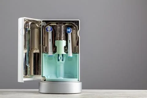 Interior of a UV light toothbrush head sanitizer with two brush heads inserte Stock Photos