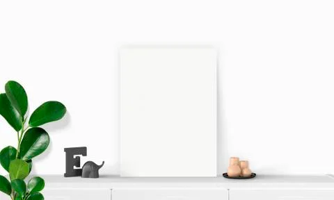 Interior vertical rectangular poster mockup standing on the table with plant  Stock Photos