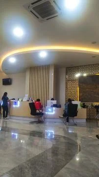 Interior vertical view of the spacious modern service lobby at Purwokert Stock Photos