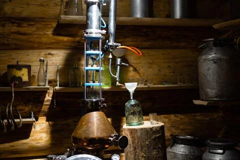 Interior of very old wine cellar with vintage wine pump and dried meat Fotos de archivo