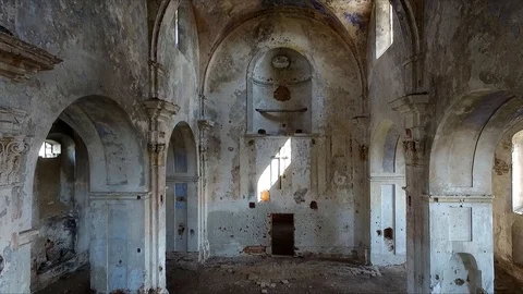 Interior view of abandoned and damaged Church shooting drone Stock Footage 106758711