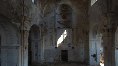 Interior view of abandoned and damaged Church shooting drone Stock Footage 108842323