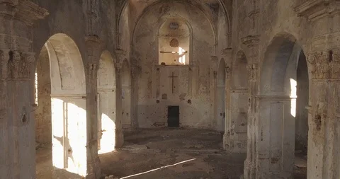 Interior view of abandoned and damaged Church shooting drone Stock Footage 117174896