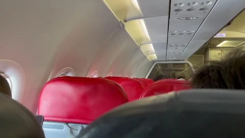 Interior View of Airplane Cabin Showing Seats and Overhead Compartments Stock Footage 305955247
