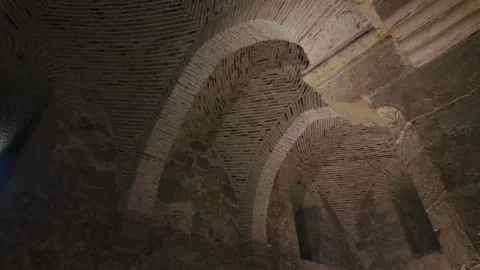 Interior View of Ancient Medieval Castle Dark Stone Walls and Arches Stock Footage 343571158