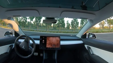 Interior view of autonomous driverless self-driving car using advanced summon Stock Footage 118803529