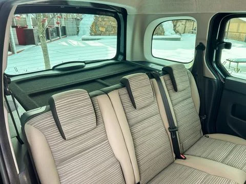 Interior view of the back seat of a car showing spacious seating area suita.. Stock Photos