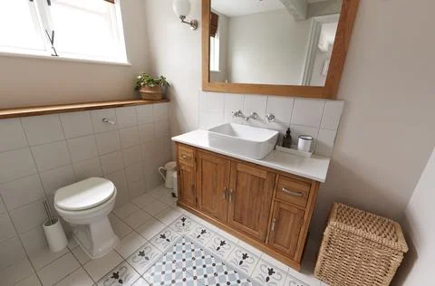 Interior View Of Beautiful Bathroom With Wash Basin And WC  In Family Home Stock Photos