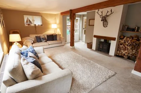 Interior View Of Beautiful Lounge With Sofas And Log Burner In Family House Stock Photos