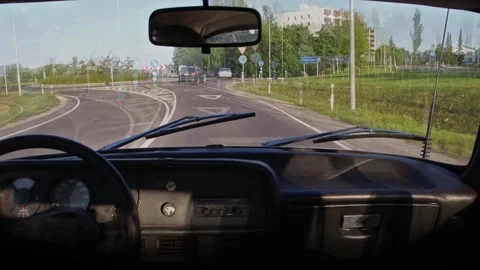 An interior view of a blurry drunk driving in a vintage classic car Stock Footage 135546328