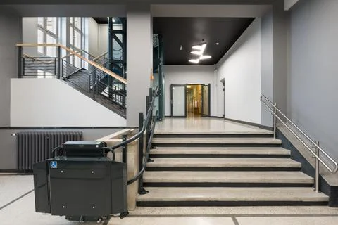 Interior View of a Building with Staircase, Elevator and Wheelchair Lift Stock Photos
