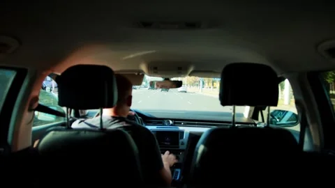 Interior view car cabin with person driving on multi-lane road daytime journey 库存影片 340385636