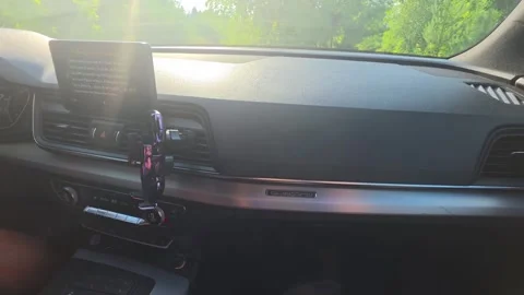 Interior view of car dashboard on sunny day, bright sunlight illuminates cockpit Stockbeeldmateriaal 342921584