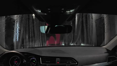 An interior view from a car during an automatic washing process, featuring soap 库存影片 333537648