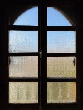 Interior View of a Classic Moroccan Riad Window with Frosted Decorative Glass Stock Photos
