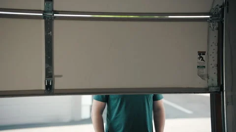 An Interior View of a Complex Garage Door Mechanism with Various Components and Stock Footage 283618786