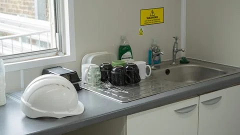 Interior view of construction site welfare cabin canteen kitchen area featuri Fotos Stock