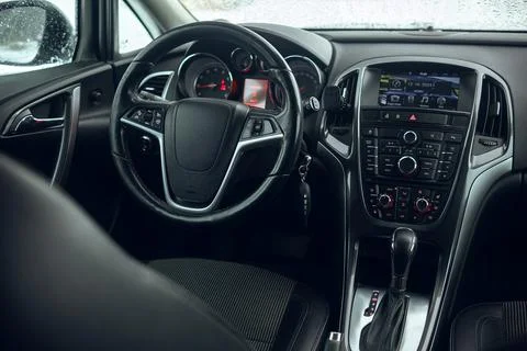Interior view of the dasboard and steering wheel of the modern car, winter time Stock Photos