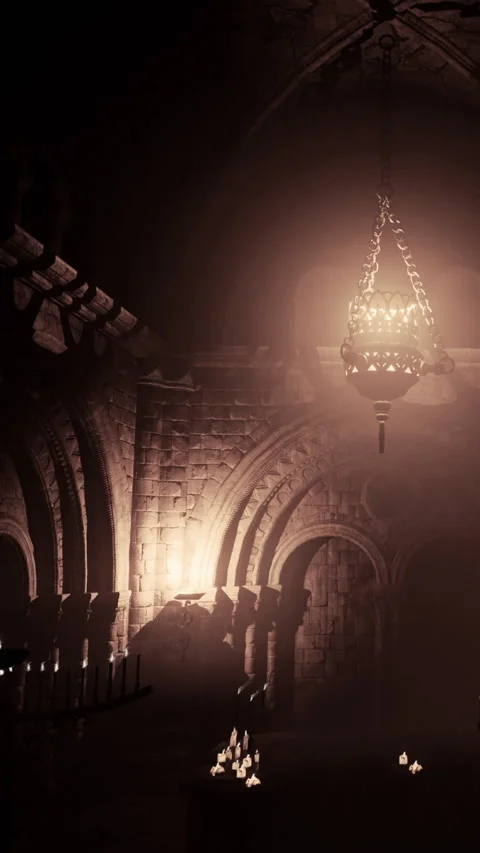 Interior view of a dimly lit stone chamber with candles at night Stock Footage 342712289