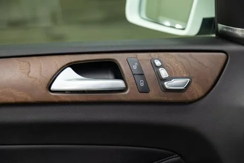 Interior view with door handle and electric seat buttons of luxury very expen Photos