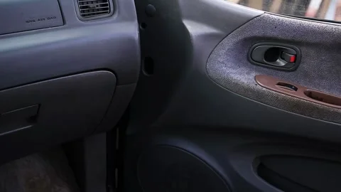 Interior view of the door panel with the passenger side door closed and opened Stock Footage 325699120