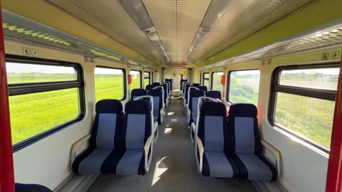 Interior View of Empty Modern Passenger Train Carriage Moving through Countrysid Stock Footage 334120298
