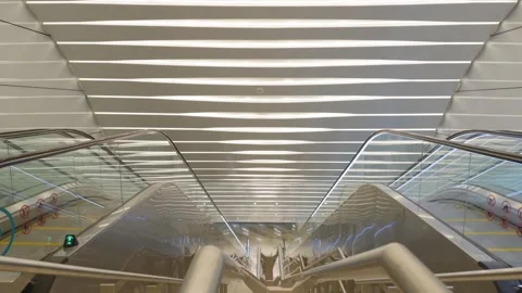 Interior view of escalators and illuminated ceiling at Ombak KLCC Vídeo Stock 346506486