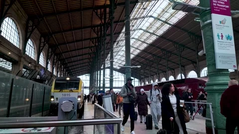 Interior view of Gare du Nord station in Paris showcasing passengers arriving Stock-Footage 330860035