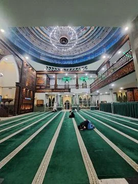 Interior View of Haji Hanif Mosque in Medan Featuring Carved Wooden Mihrab and O Stock Photos