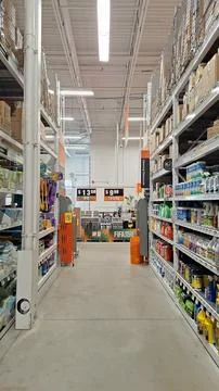 Interior view of hardware store aisle with shelves Stock Photos