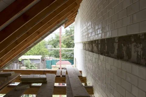 An interior view of a house attic under construction Foto stock