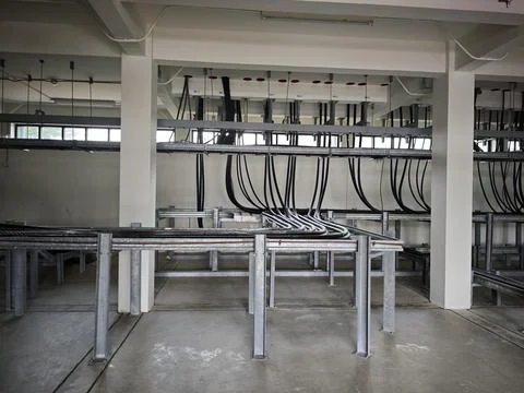 Interior view of industrial electrical cable spreading room basement. Stock Photos