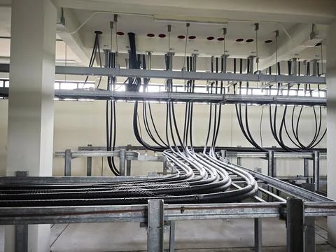 Interior view of industrial electrical cable spreading room basement. Stock Photos