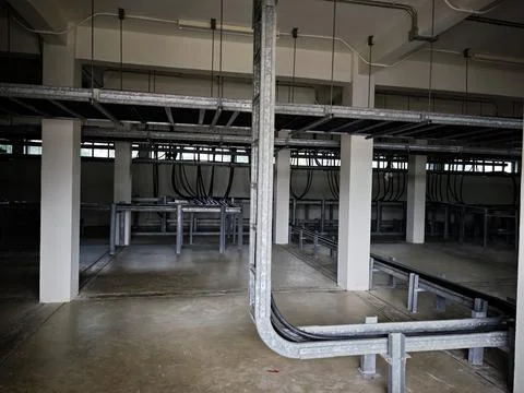 Interior view of industrial electrical cable spreading room basement. Stock Photos