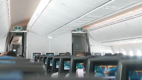 Interior view inside airplane cabin while all passenger on seat watching sa.. Stock Footage 315387804