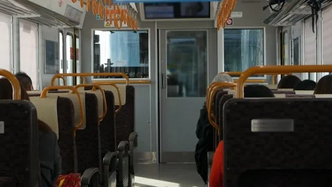 Interior view inside local train aisle with many seats in train commuters w.. 動画素材 339574940