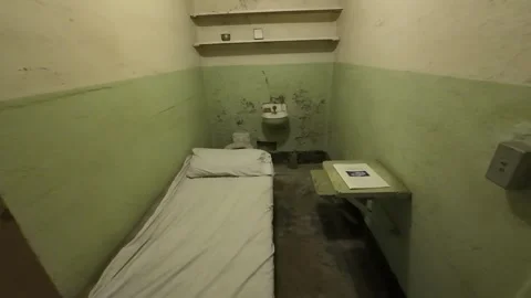 Interior View Inside an Original Prison Cell Stock Footage 328129041