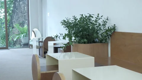 Interior view inside unknown empty minimal design cafe without any people in whi Stock Footage 294915292