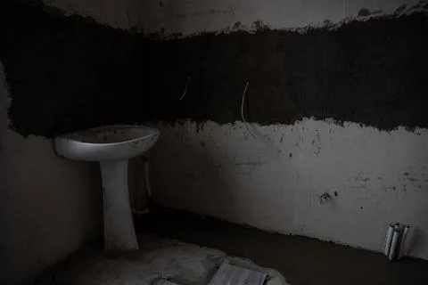 Interior view of a kitchen during renovation featuring a temporary sink. Stock Photos