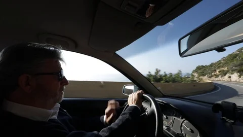 Interior view of a man driving Stock Footage 103135516