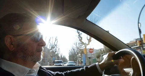 Interior view of a man driving Stock Footage 103135603