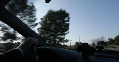 Interior view of a man driving Stock Footage 103135621