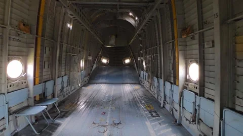 Interior view of military cargo airplane fuselage showing empty aircraft cabin, Video stock 341657737