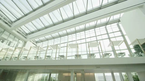 Interior view of modern office building with glass partitions &amp; central atrium Stock Footage 34977229