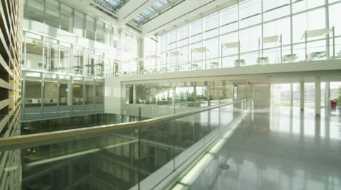 Interior view of modern office building with glass partitions & central atrium Stock Footage