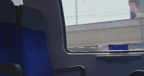 Interior view from moving train passing concrete railway overpass in Zurich Stock Footage 341853967