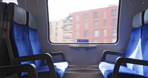 Interior view from moving train passing urban residential buildings in Zurich Stock Footage 341854298