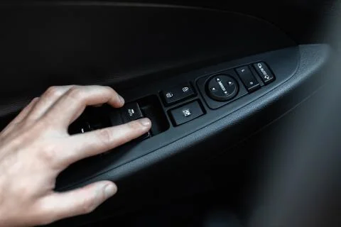 Interior view of a new car. Window control buttons Stock Photos