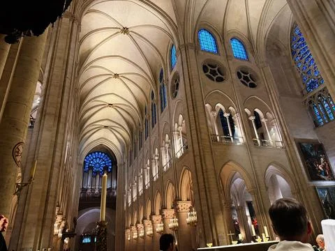 Interior view of Notre Dame cathedral nave with vaulted Gothic ceilings and.. Stock Photos