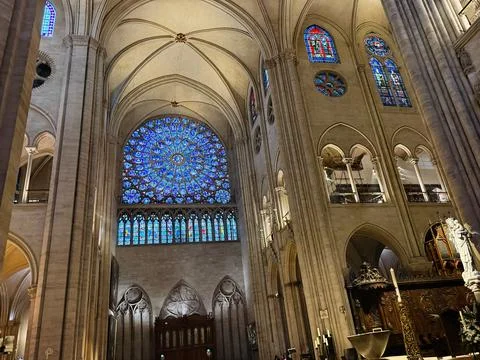 Interior view of Notre-Dame cathedral with rose window and stained glass in.. 스톡 사진